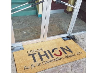 Tapis publicitaire Thion